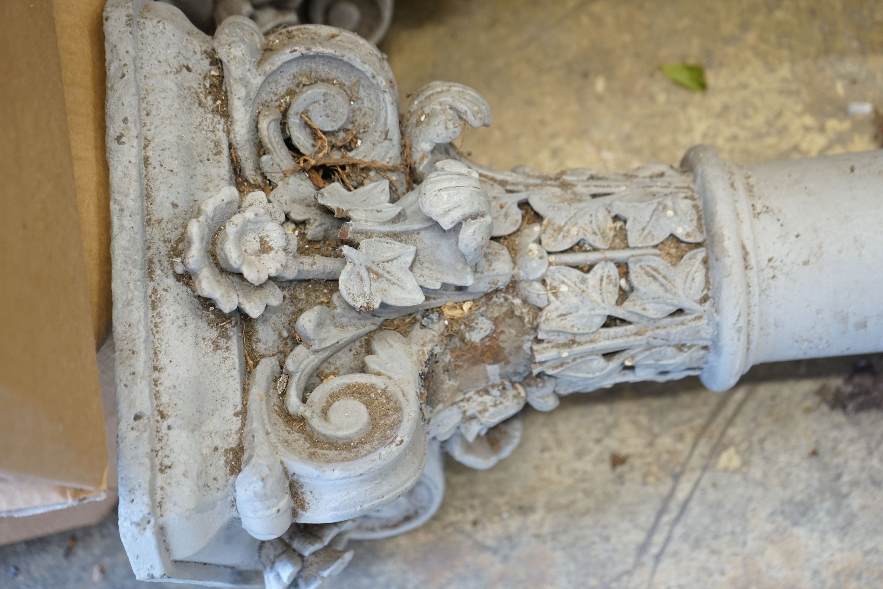 A pair of Victorian painted cast iron Corinthian columns, by repute from a West London Railway station, now demolished, height 252cm